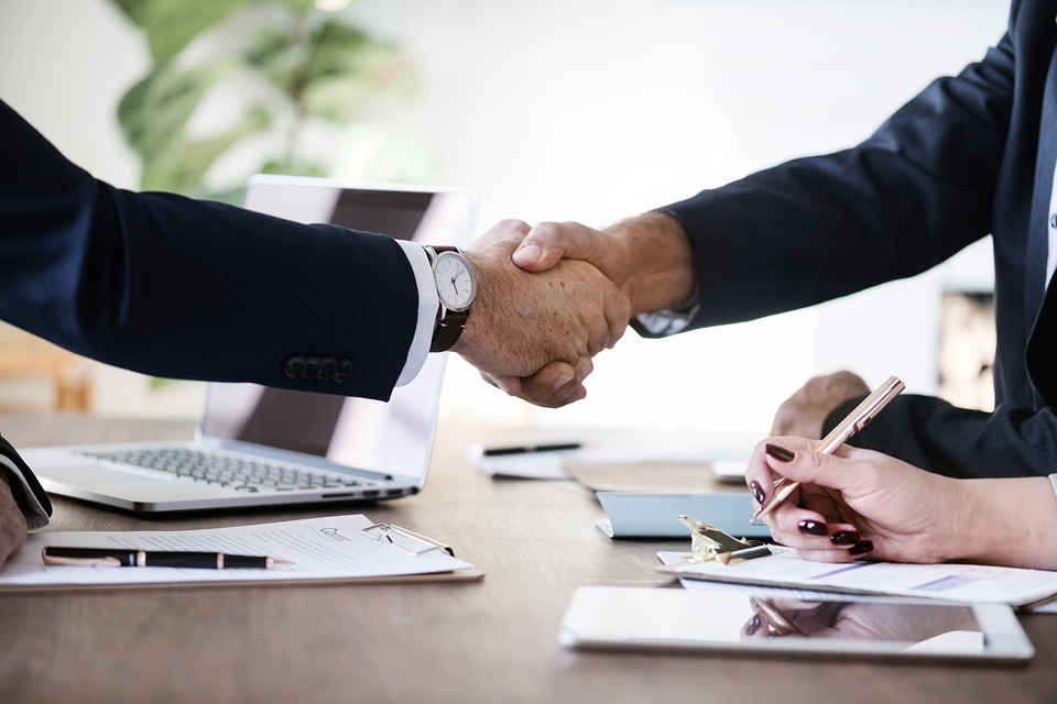 A handshake between two professional veterans